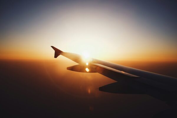 Plane wing in the sunrise